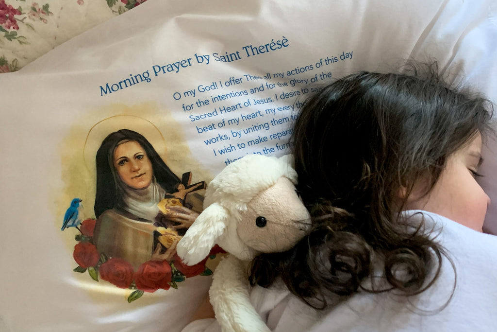Our Catholic gift products like this St. Therese Prayer pillow case increase coziness and holiness and are used every day!