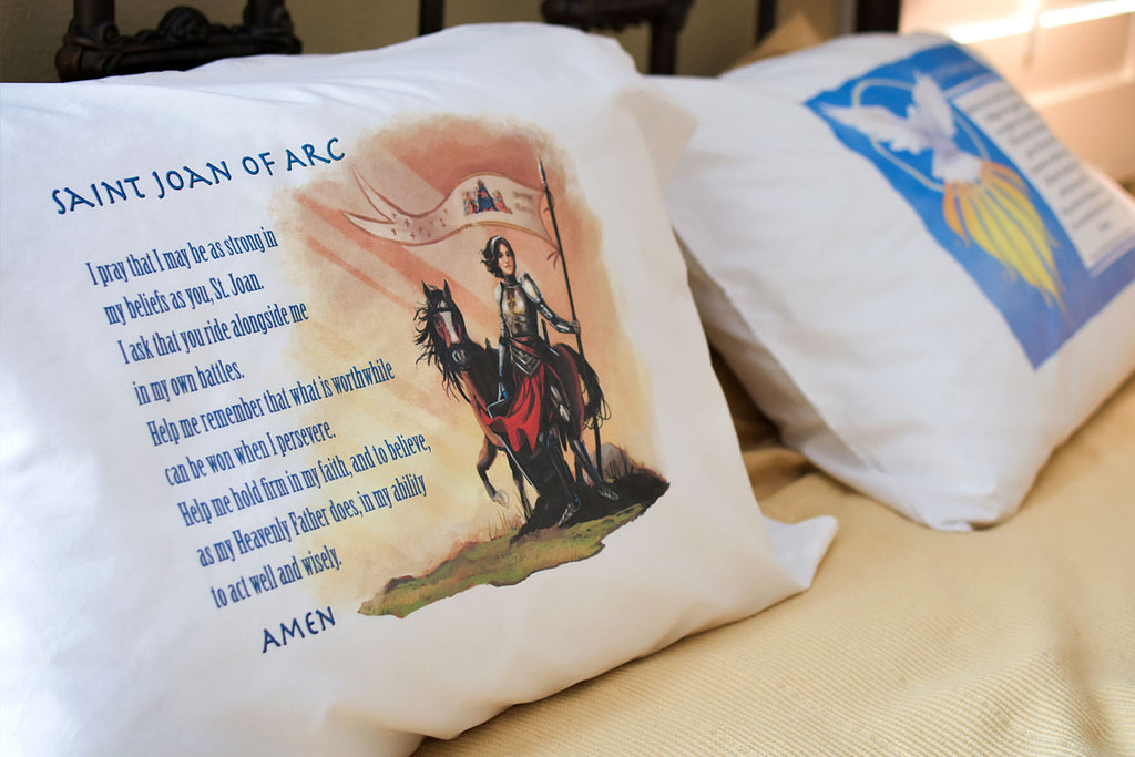 Liturigical living and daily prayer made easy with Catholic Prayer Pillowcases like these Joan of Arc and Holy Spirit desgns.