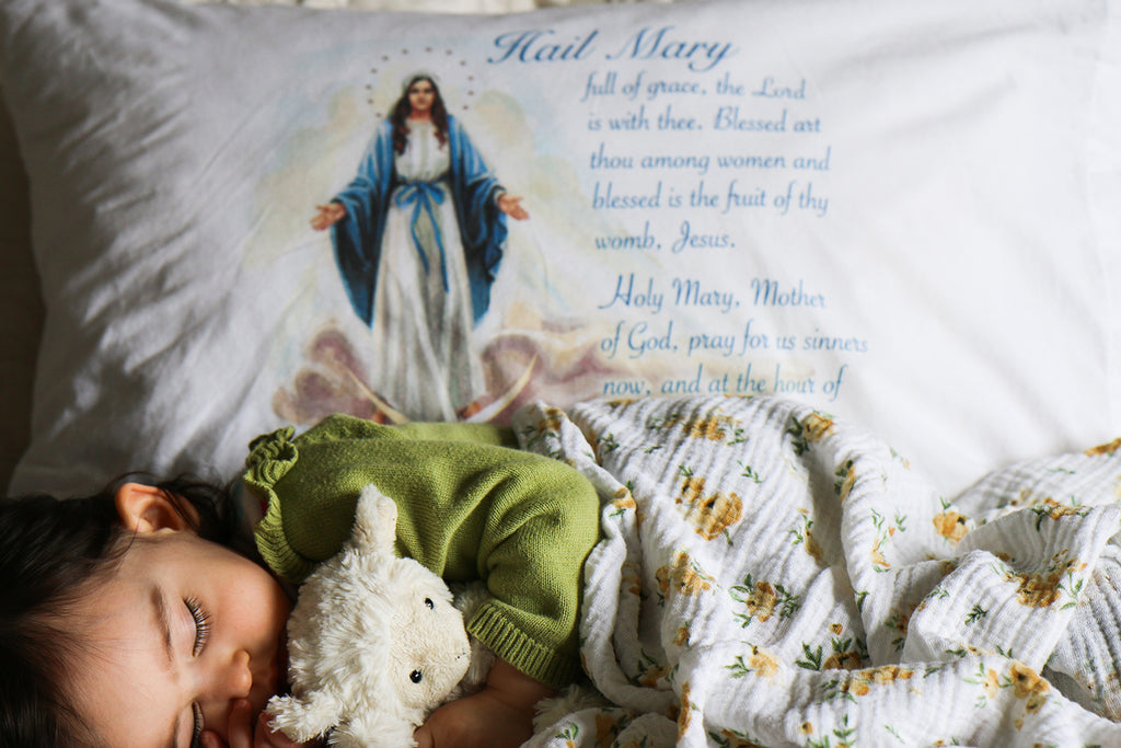 Pretty Catholic pillowcases, like this one with the Hail Mary prayer, bring Mary into your family's daily life.